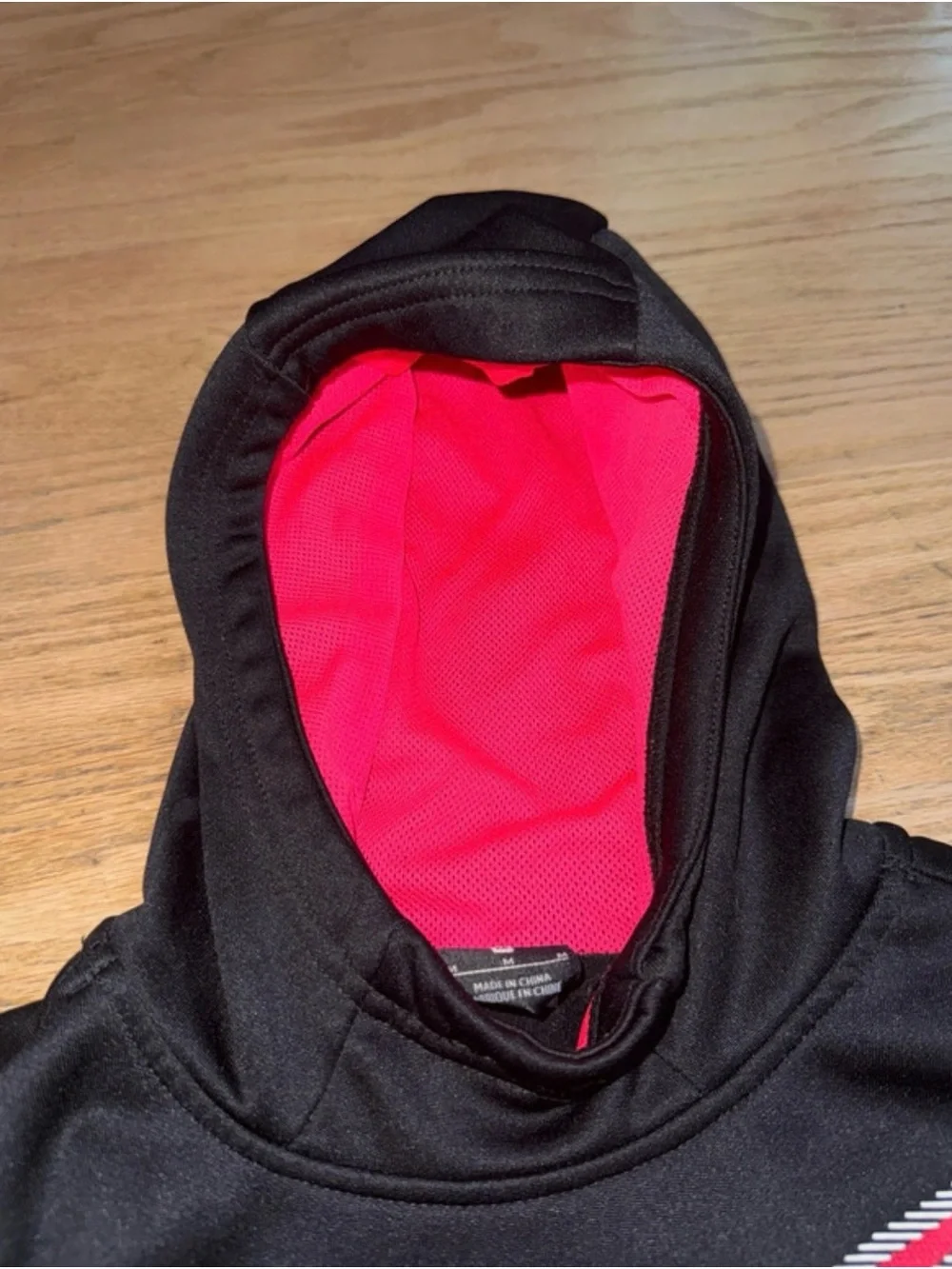 Nike Kids Black Hoodie with Pink Swoosh and pink Hood Lining